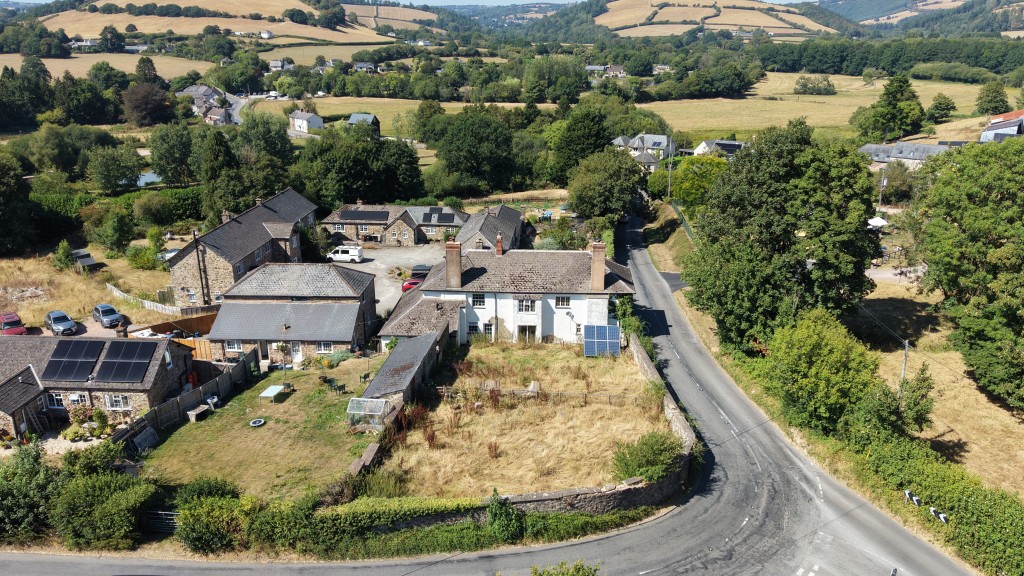 Lot: 222 - THREE-BEDROOM FARMHOUSE AND ATTACHED TWO-BEDROOM ANNEX - FREEHOLD INVESTMENT - Aerial view of rear of Higher Grants Farmhouse and The Annex